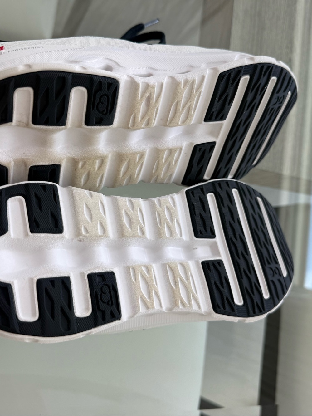 On Cloud- like new White Athletic Sneakers with Black Outsole Accents